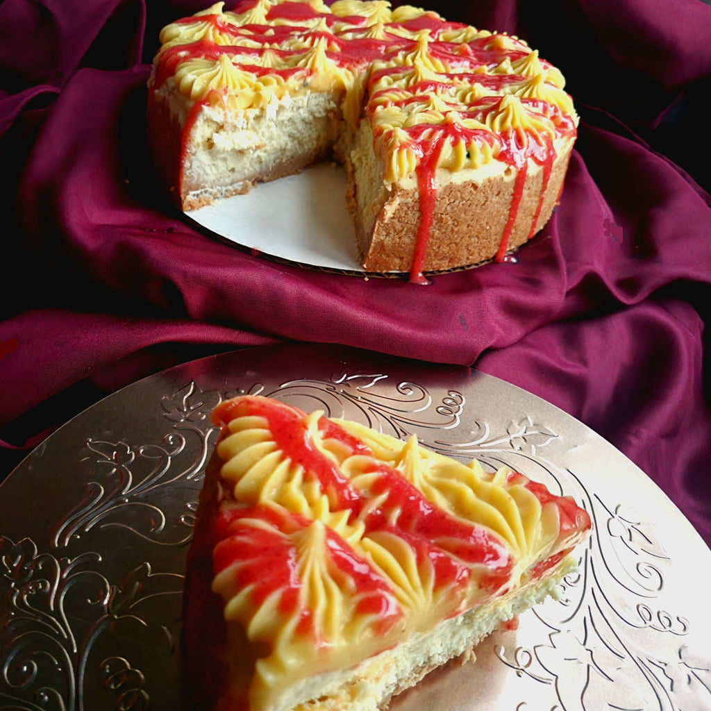 Strawberry Mango cheesecake on a purple fabric background